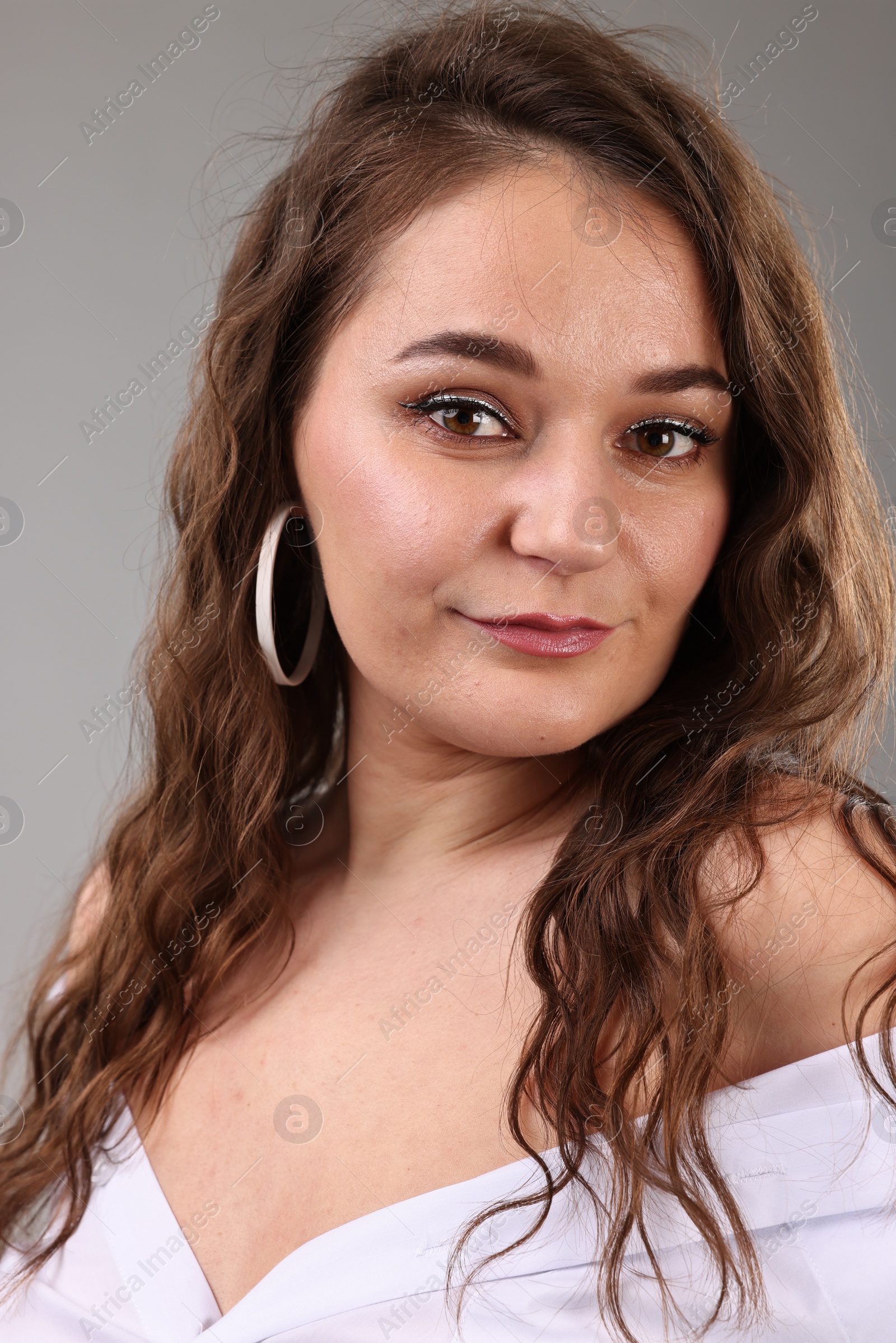 Photo of Portrait of beautiful woman on light grey background