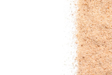 Pile of fresh bread crumbs on white background, top view