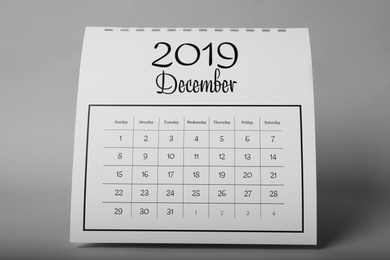 Paper calendar on grey background. Planning concept