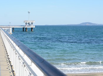 Picturesque view of pier and beautiful blue sea on sunny day