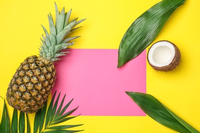 Photo of Fresh pineapple and coconut on color background, flat lay