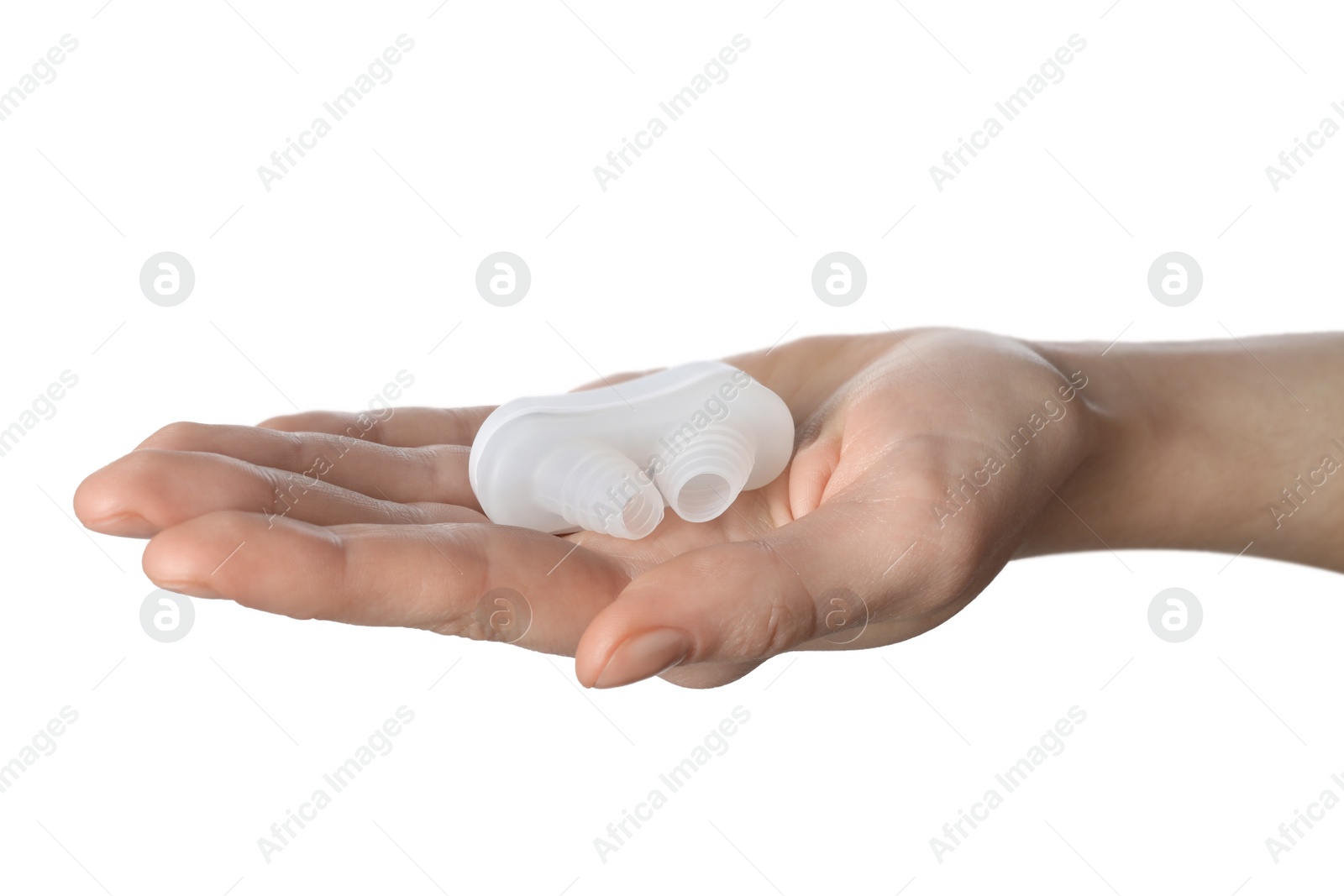 Photo of Woman holding anti-snoring device for nose on white background, closeup