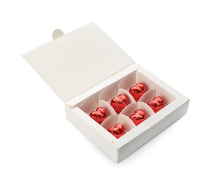 Heart shaped chocolate candies in box on white background