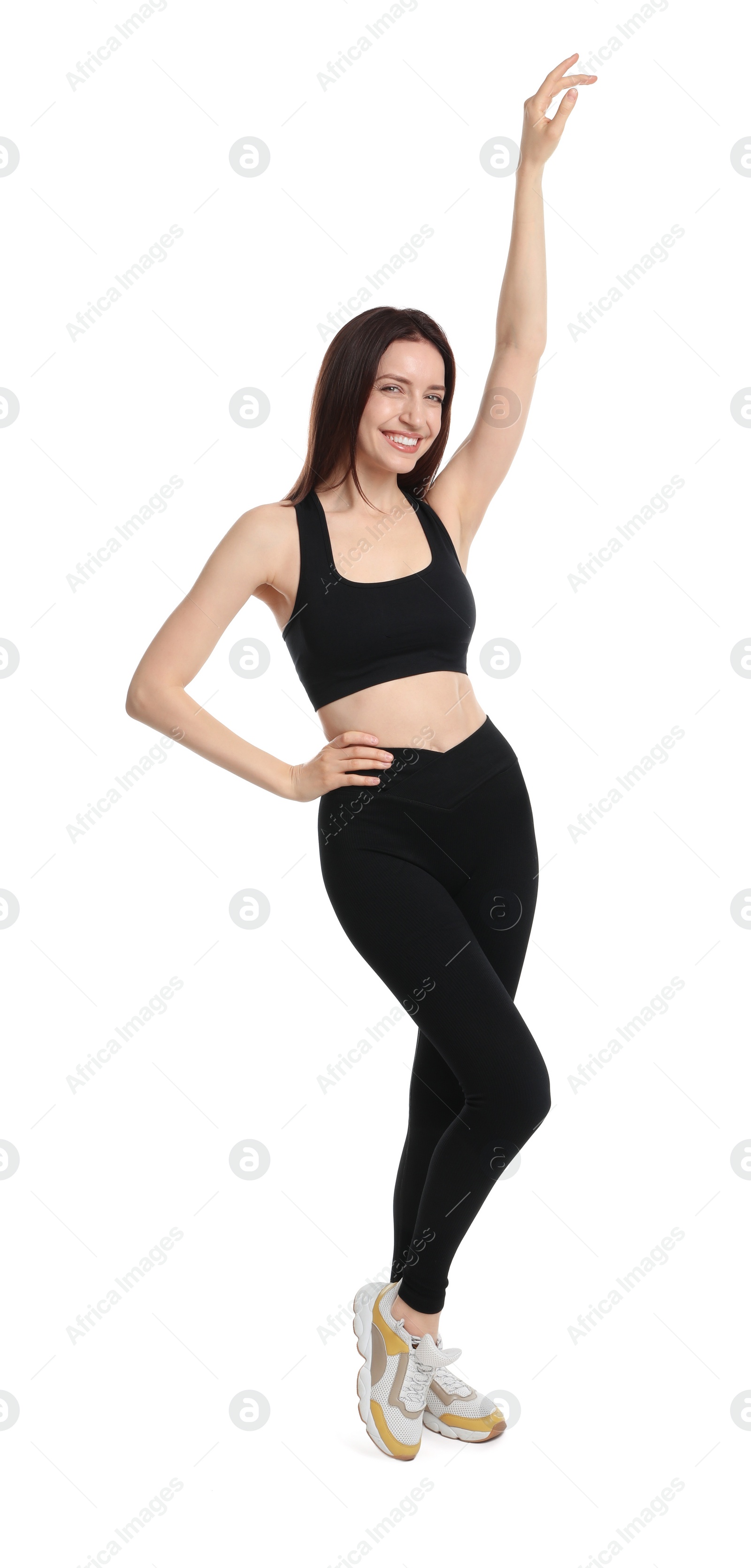 Photo of Happy young woman with slim body posing on white background