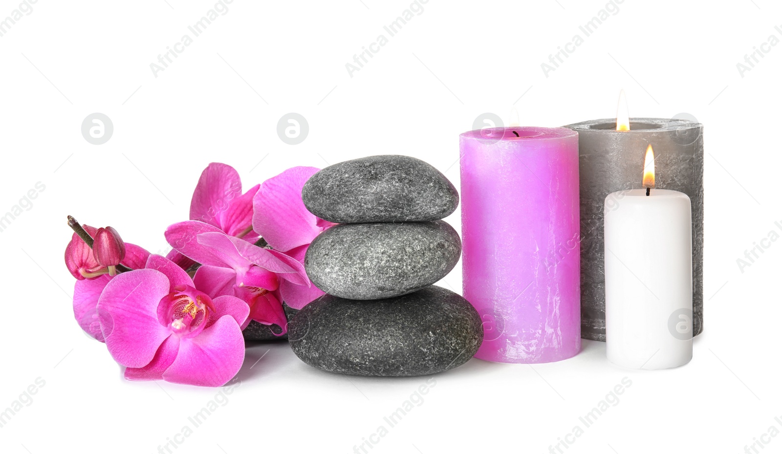 Photo of Composition with spa stones and candles on white background