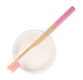 Photo of Bowl of tooth powder and brush on white background, top view