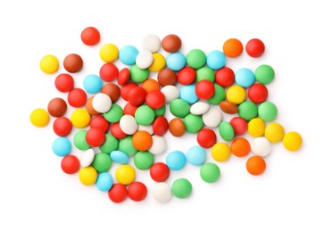 Photo of Many small colorful candies on white background, top view