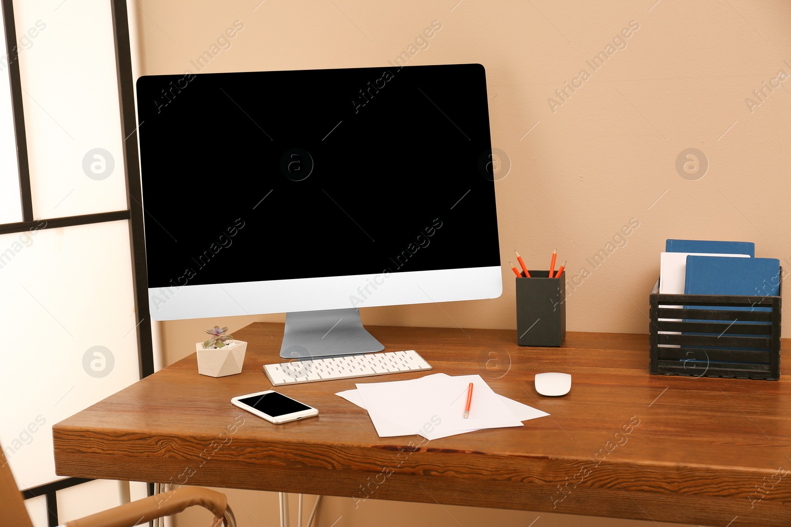 Photo of Comfortable workplace with modern computer on table. Space for design