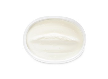 Photo of Plastic container of tasty cream cheese isolated on white, top view