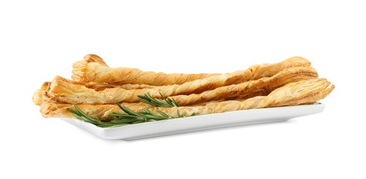 Plate with delicious grissini and rosemary on white background