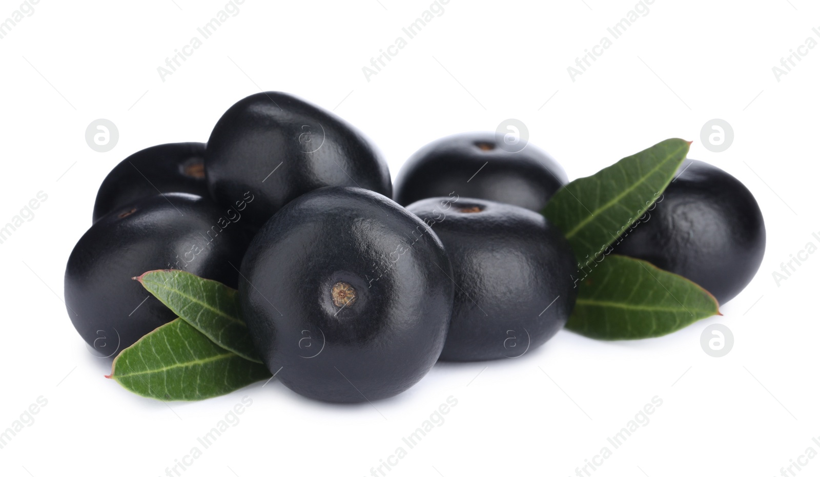 Photo of Pile of fresh ripe acai berries and green leaves on white background