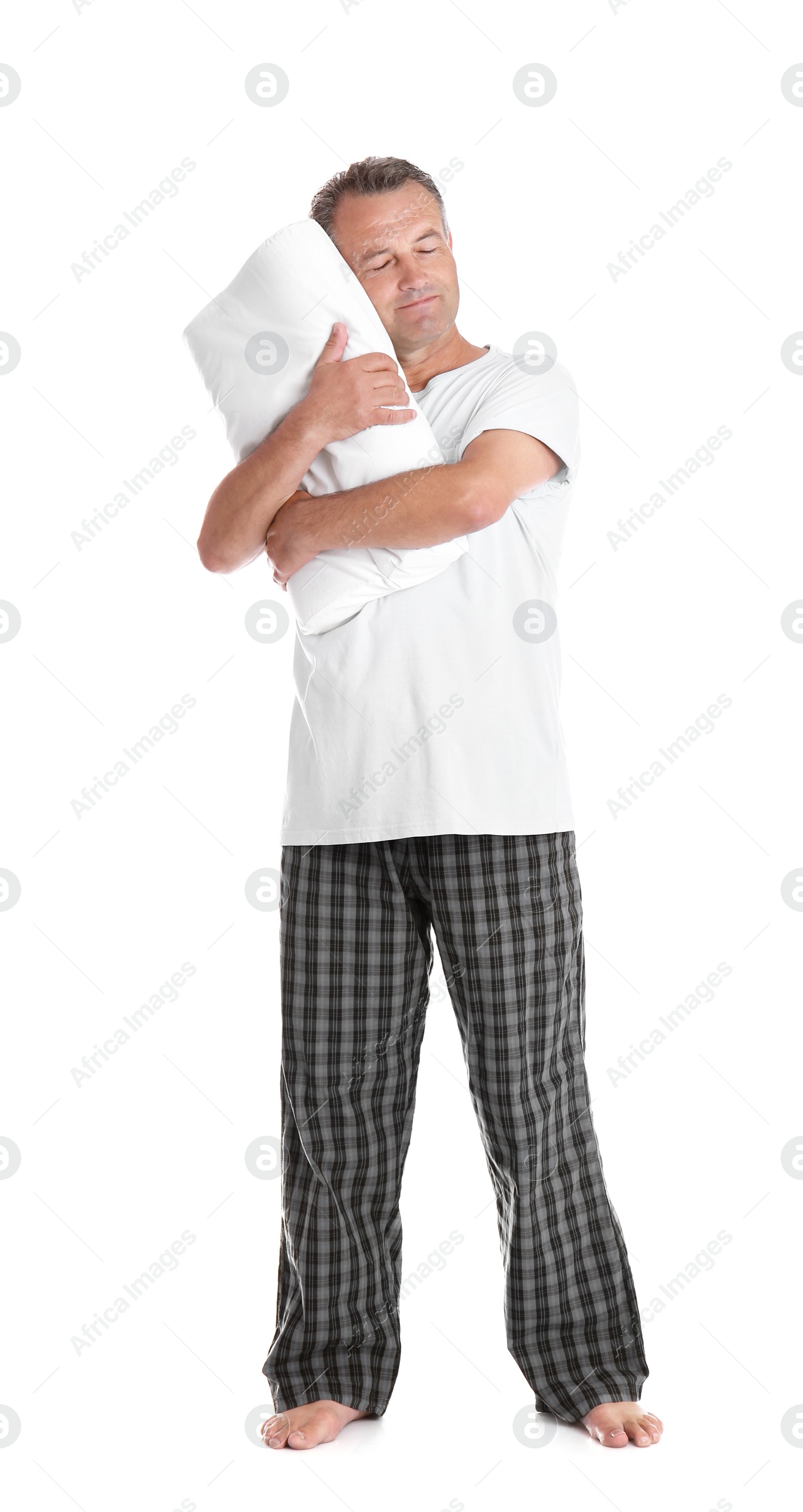 Photo of Man holding soft pillow on white background