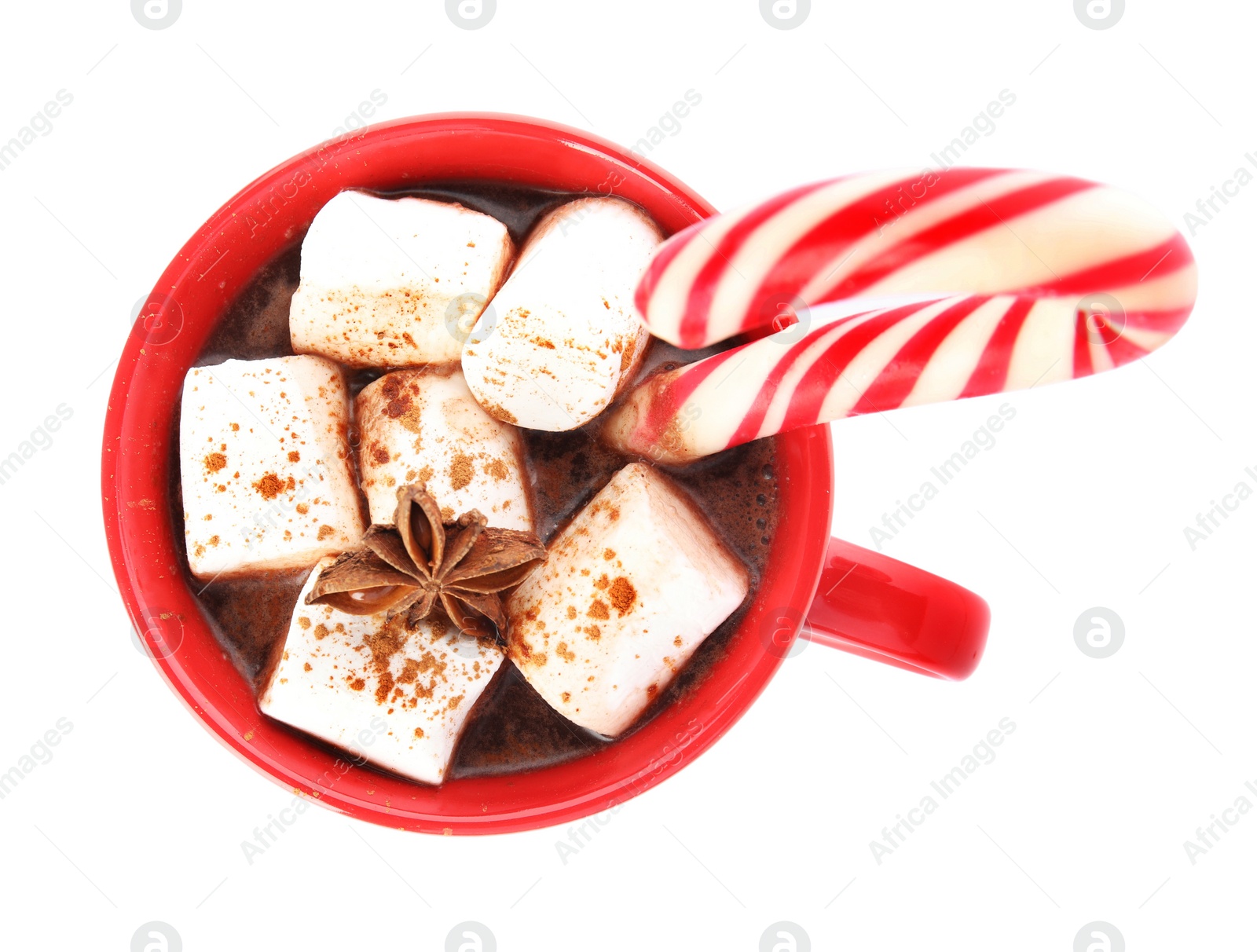 Photo of Cup of hot chocolate with marshmallows, Christmas candy cane and anise isolated on white, top view