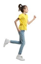 Photo of Cute little girl running on white background