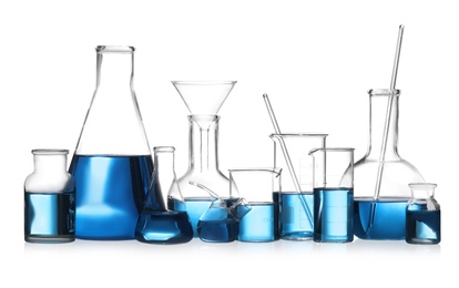 Set of laboratory glassware with blue liquid isolated on white