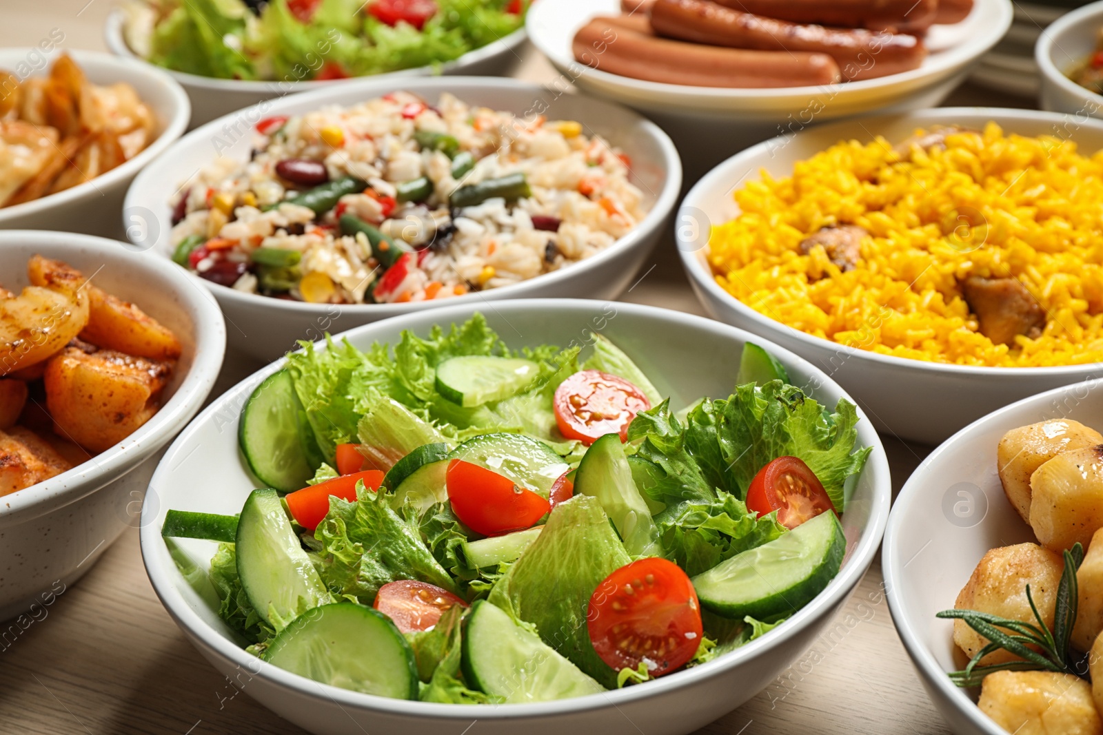 Photo of Different delicious dishes on table, closeup. Buffet service