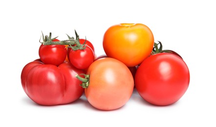 Photo of Many different ripe tomatoes on white background