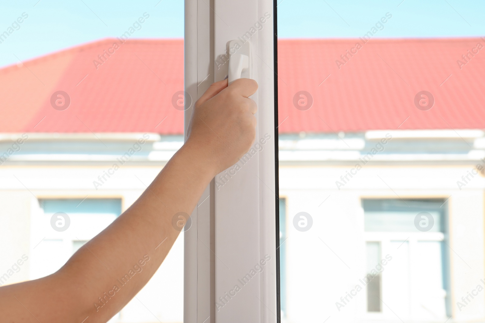 Photo of Woman opening new modern window, closeup view