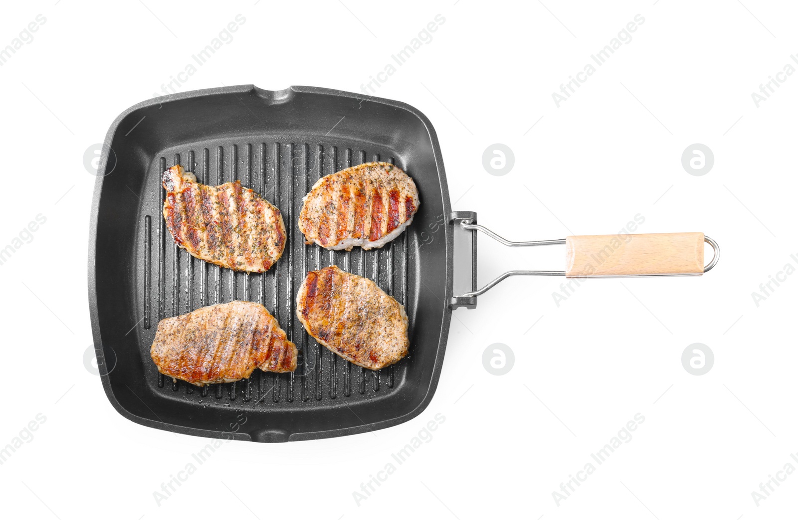 Photo of Grill pan with delicious pork steaks isolated on white, top view