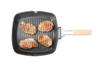 Grill pan with delicious pork steaks isolated on white, top view