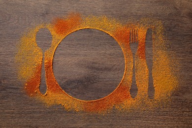 Photo of Silhouettes of cutlery and plate made with spices on wooden table, top view. Space for text
