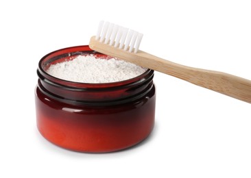 Jar of tooth powder and brush on white background