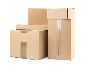 Photo of Pile of cardboard boxes on white background