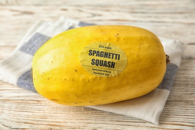 Photo of Whole ripe spaghetti squash on wooden table