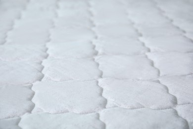 Photo of New white mattress as background, closeup view