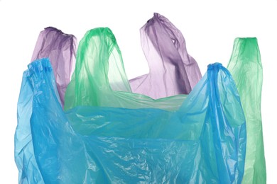 Photo of Many different plastic bags on white background