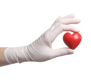 Photo of Doctor in medical glove holding red heart on white background, closeup