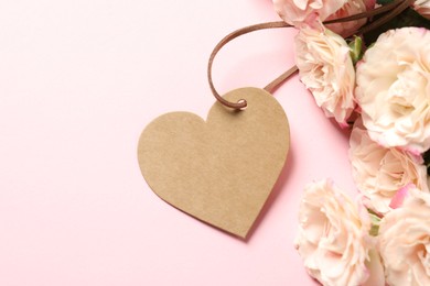 Photo of Happy Mother's Day. Beautiful flowers with blank heart shaped card on pink background