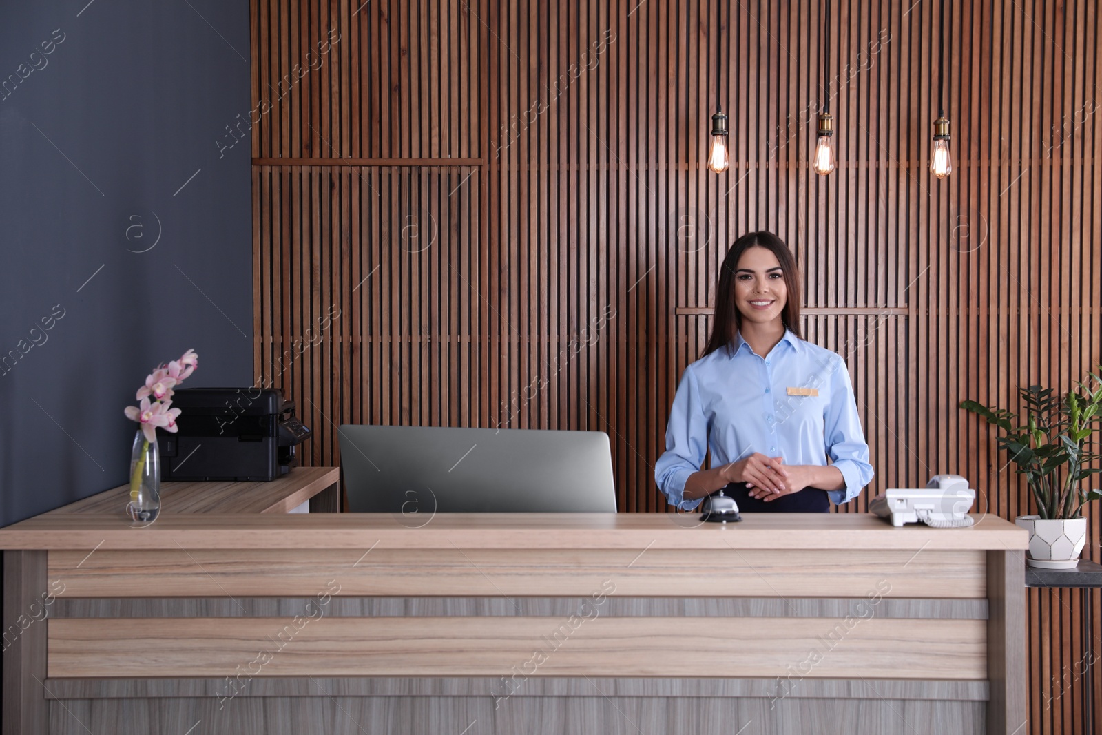 Photo of Portrait of receptionist at desk in lobby