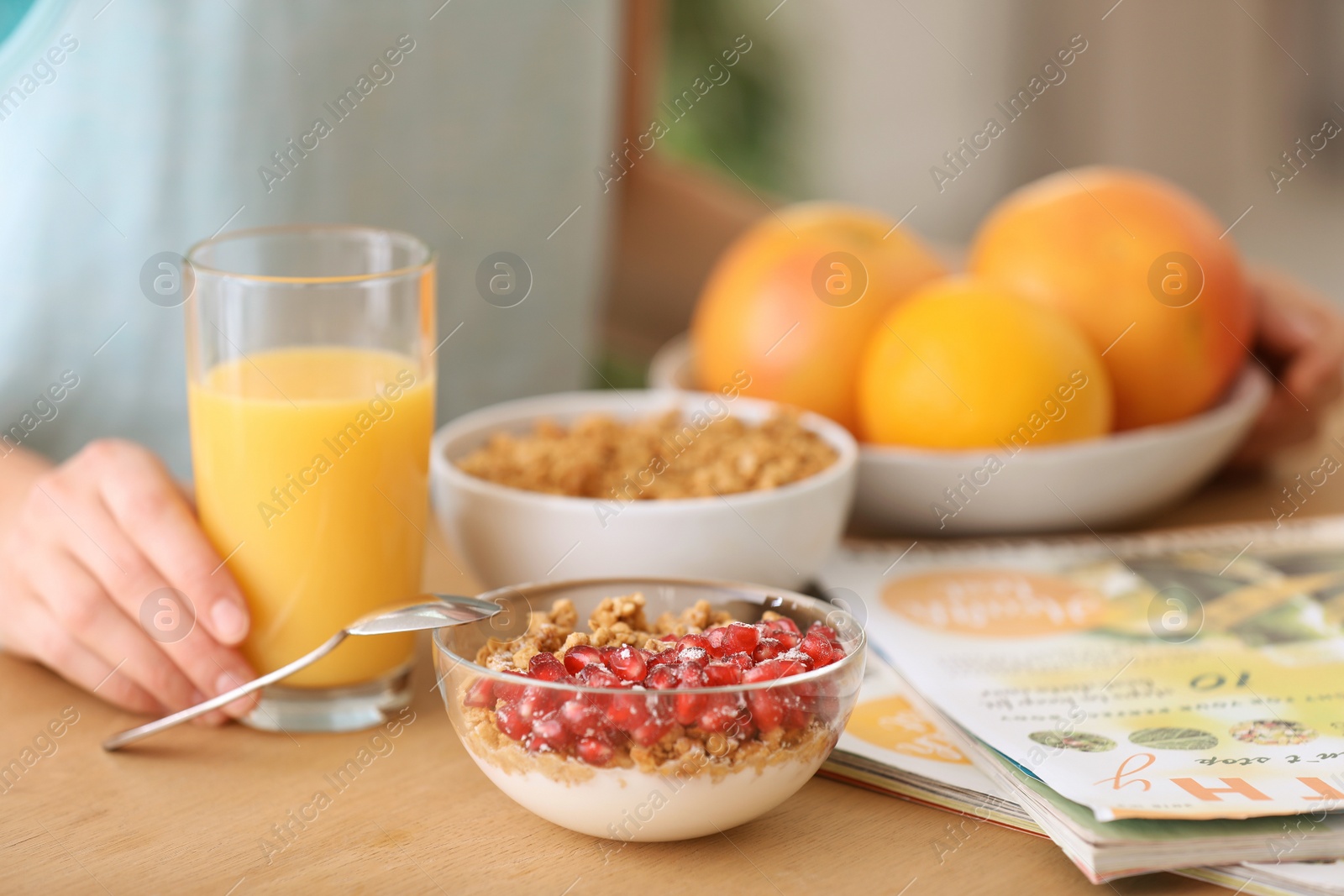 Photo of Young woman having healthy breakfast at home, closeup. Fitness diet