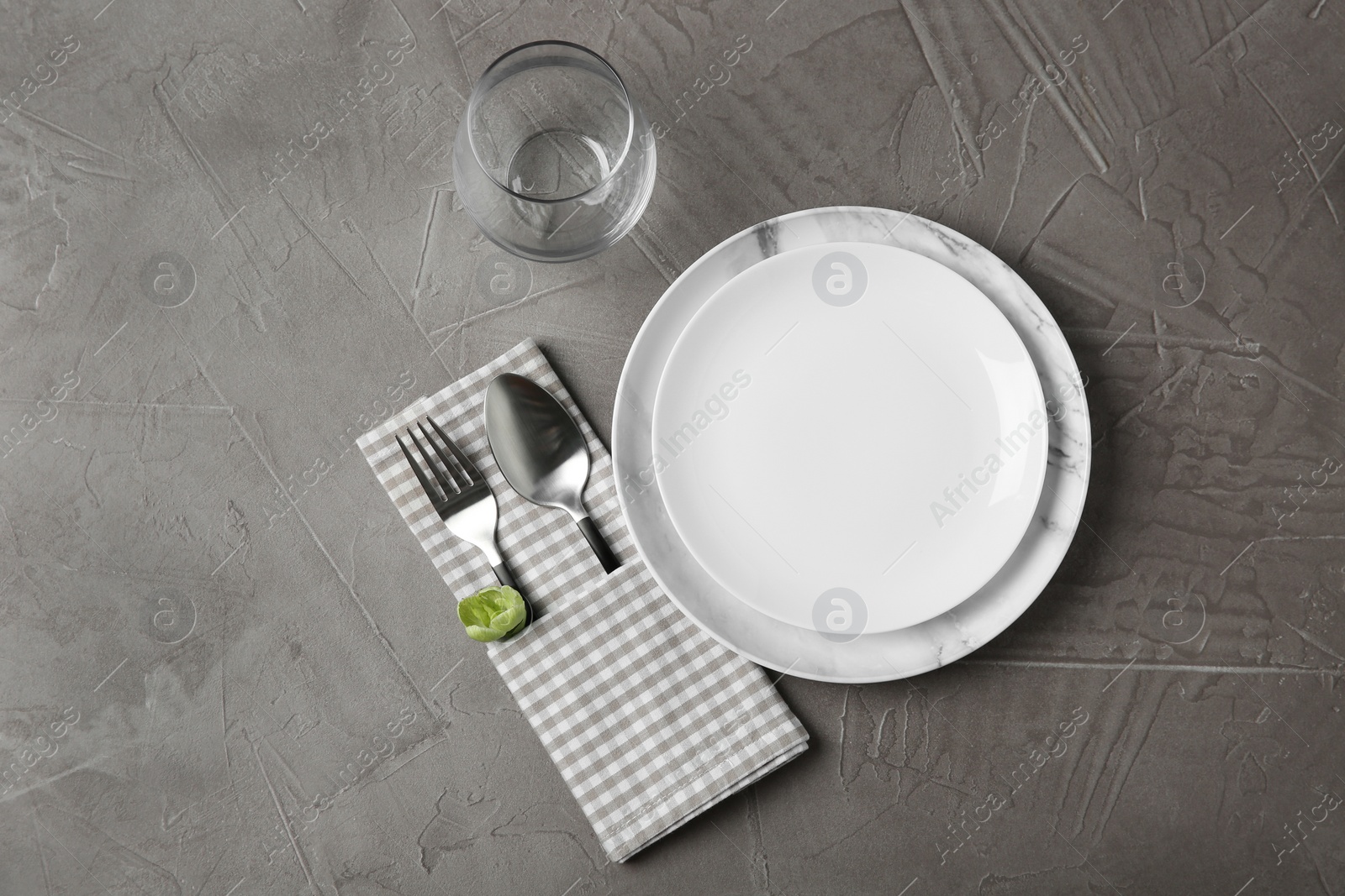 Photo of Beautiful table setting on grey background, flat lay