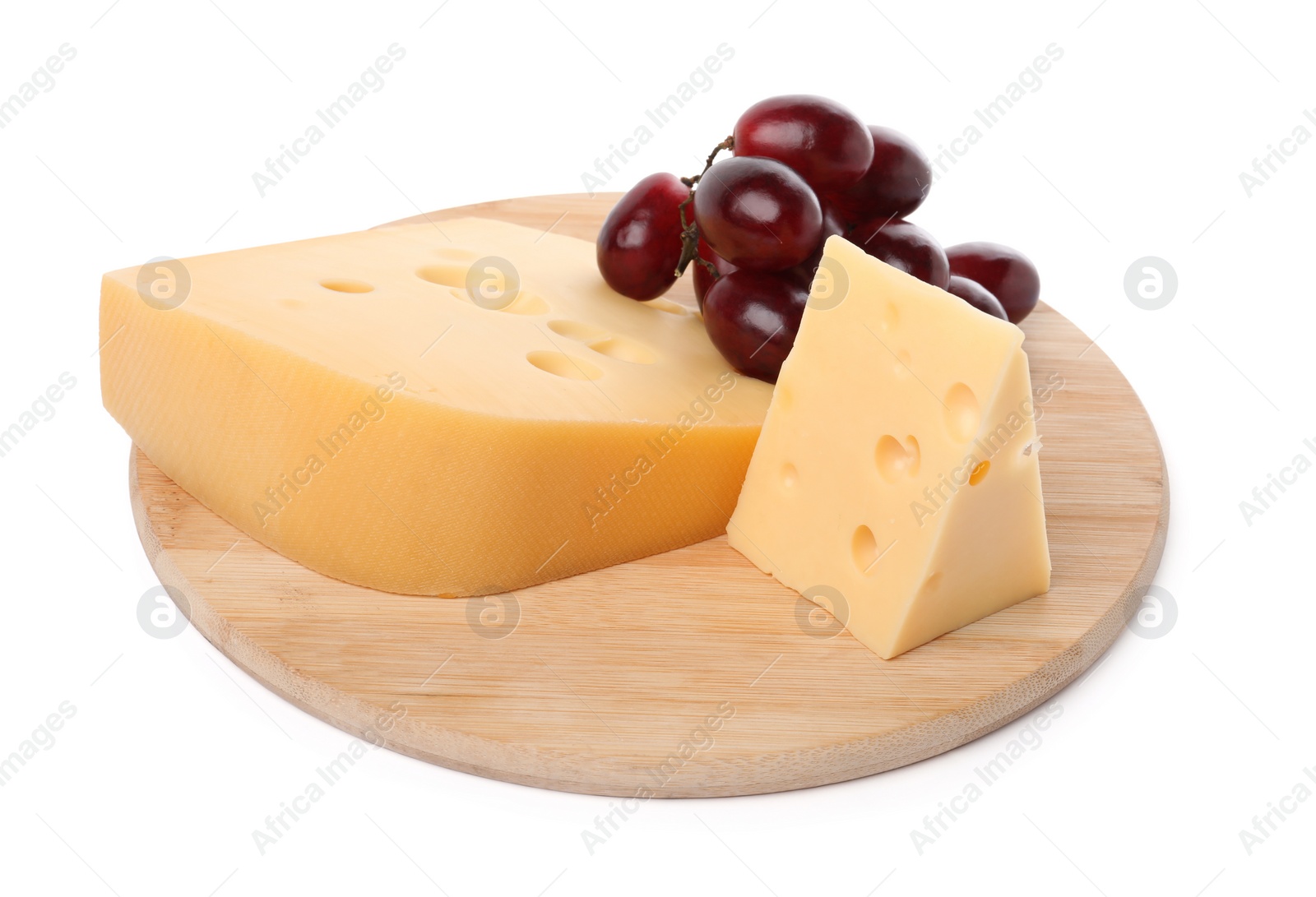 Photo of Pieces of delicious cheese and grapes isolated on white