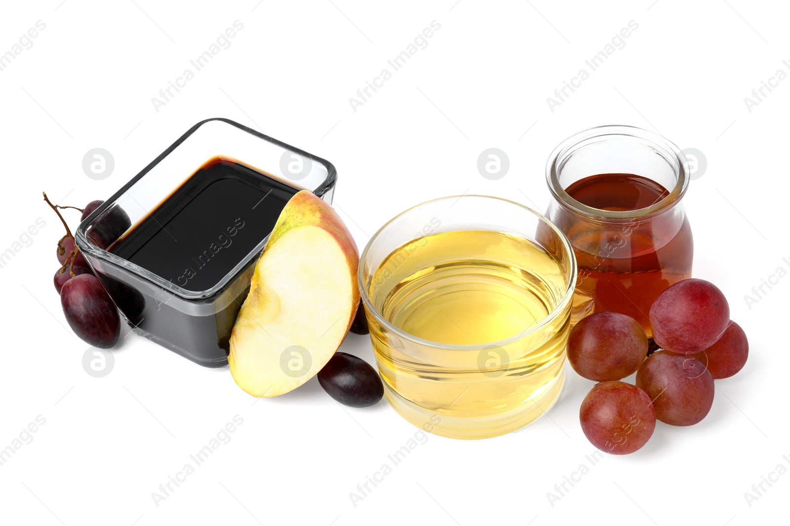 Photo of Different types of vinegar and ingredients isolated on white