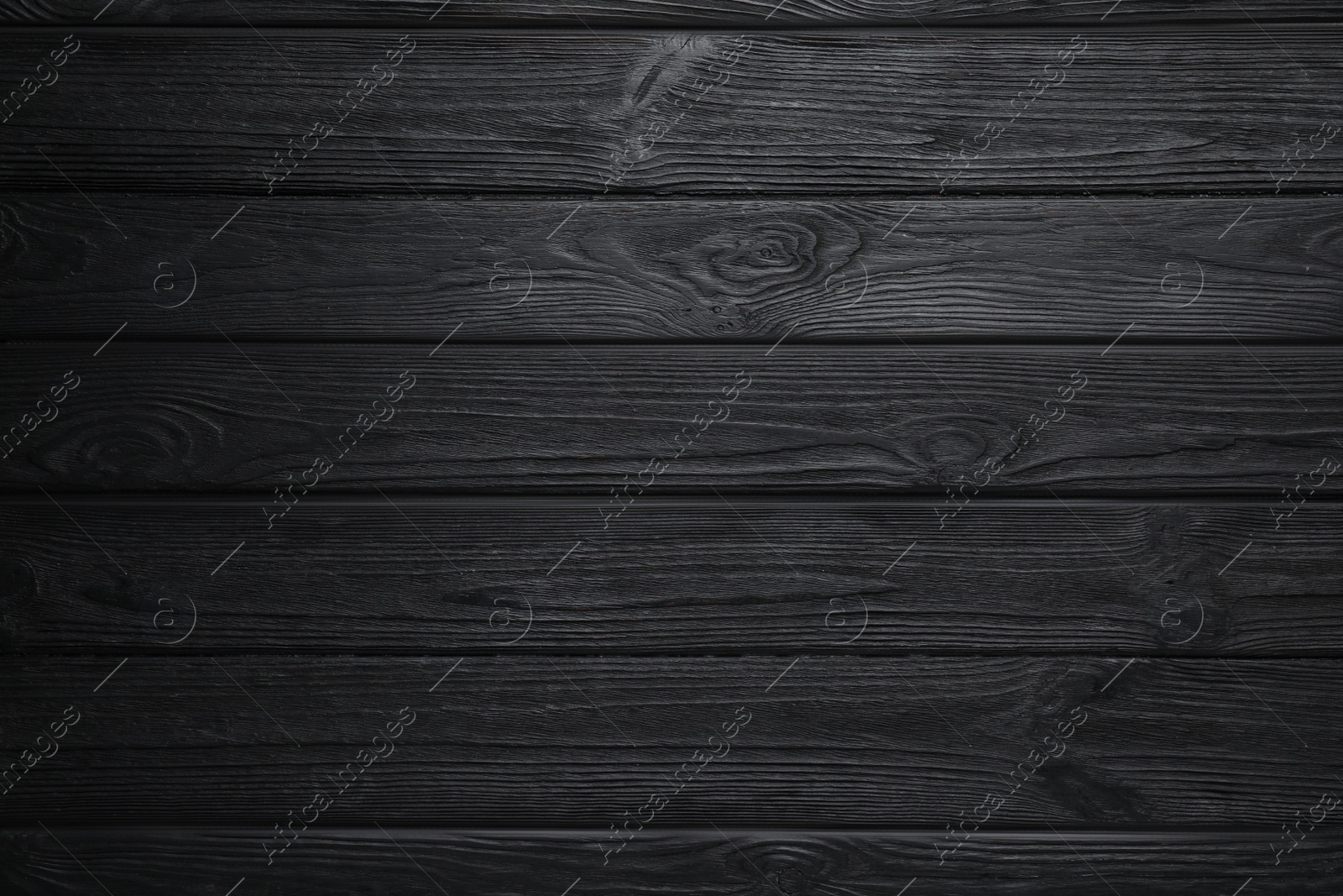 Photo of Texture of black wooden surface as background, top view