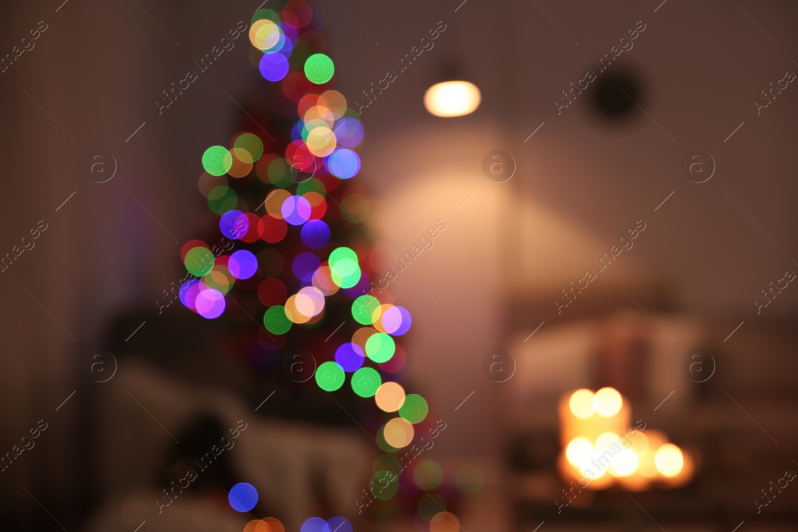 Photo of Blurred view of stylish room interior with decorated Christmas tree