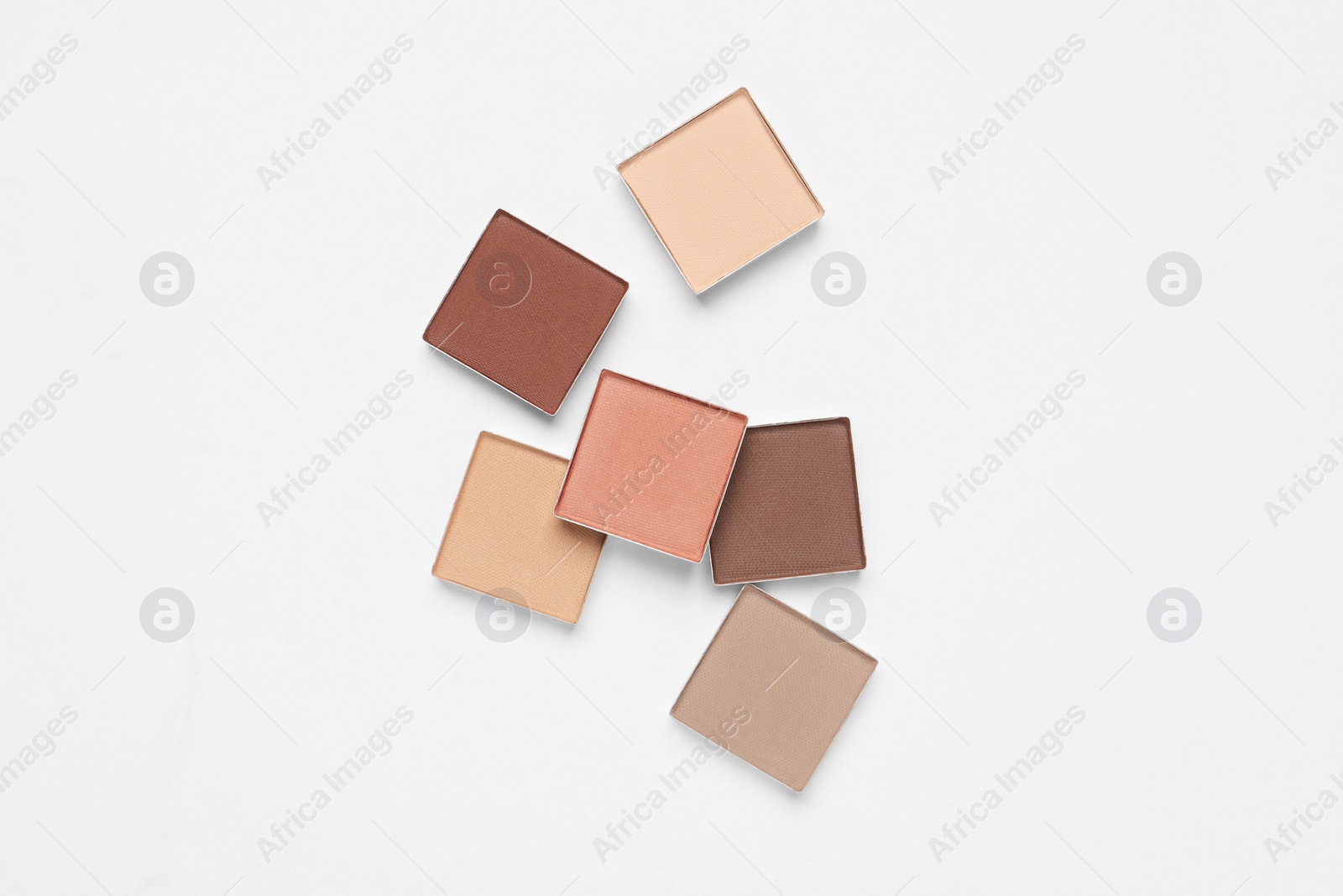 Photo of Different beautiful eye shadows on white background, flat lay