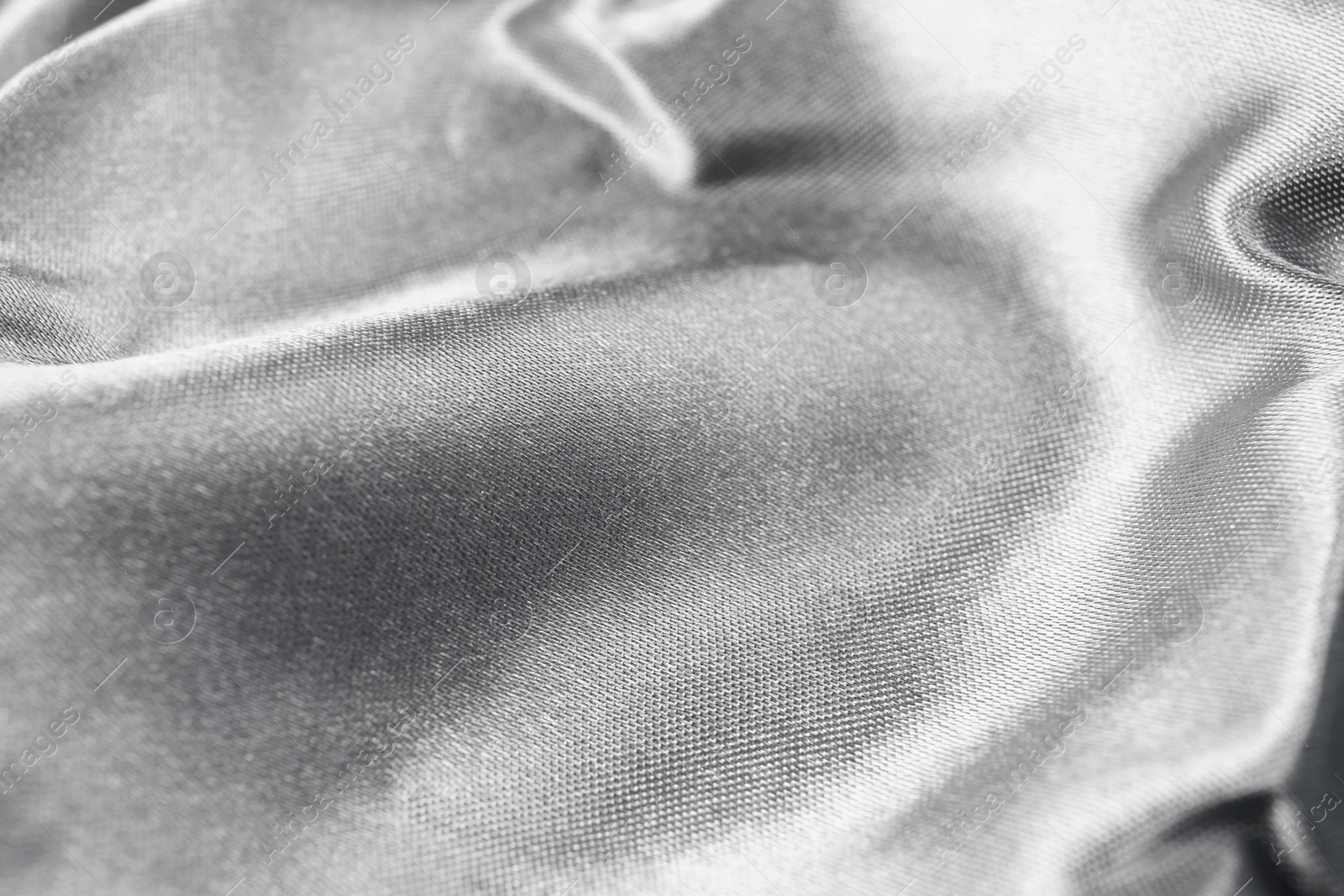 Photo of Texture of silver fabric as background, closeup
