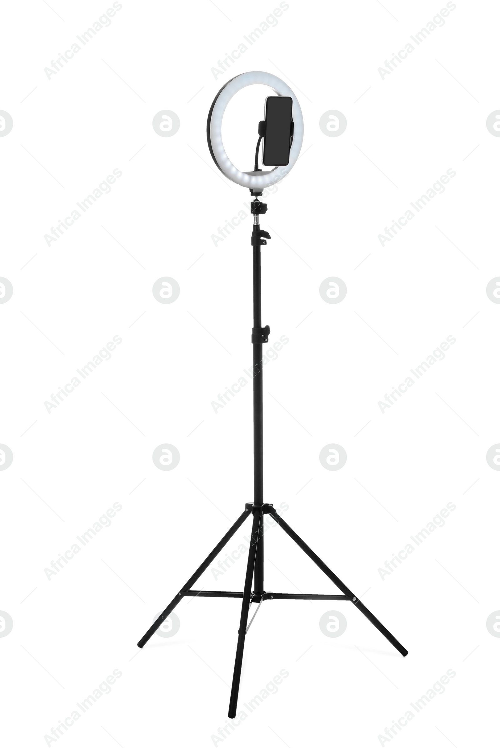 Photo of Tripod with ring light and smartphone isolated on white