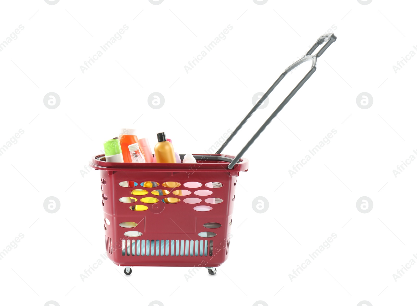 Photo of Shopping basket full of cleaning supplies isolated on white