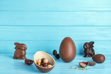 Photo of Composition with chocolate Easter eggs on table