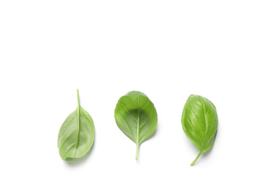 Photo of Fresh green basil leaves on white background, top view