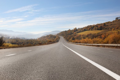 Photo of Landscape with asphalt road leading to mountains