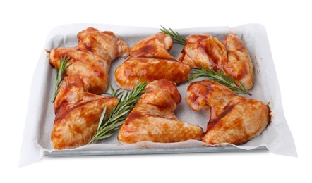 Photo of Raw marinated chicken wings and rosemary isolated on white