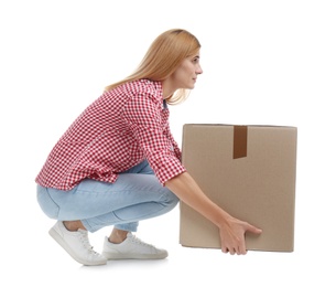 Full length portrait of woman lifting carton box on white background. Posture concept