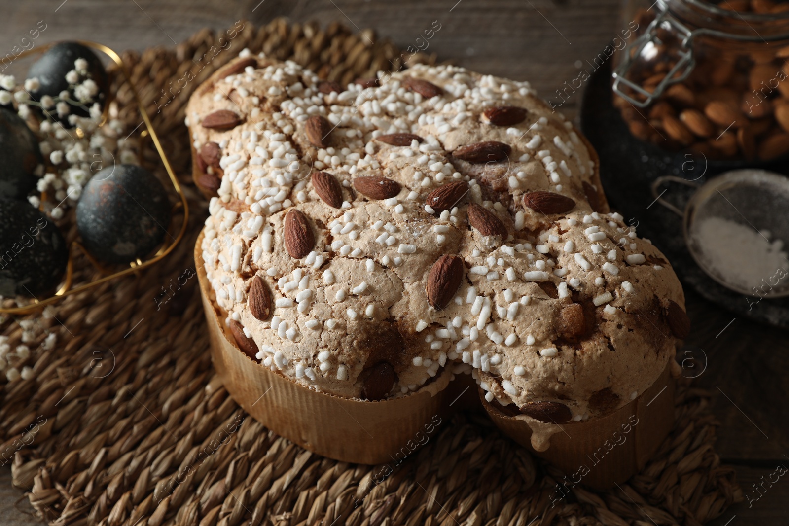 Photo of Delicious Italian Easter dove cake (traditional Colomba di Pasqua) on wooden table