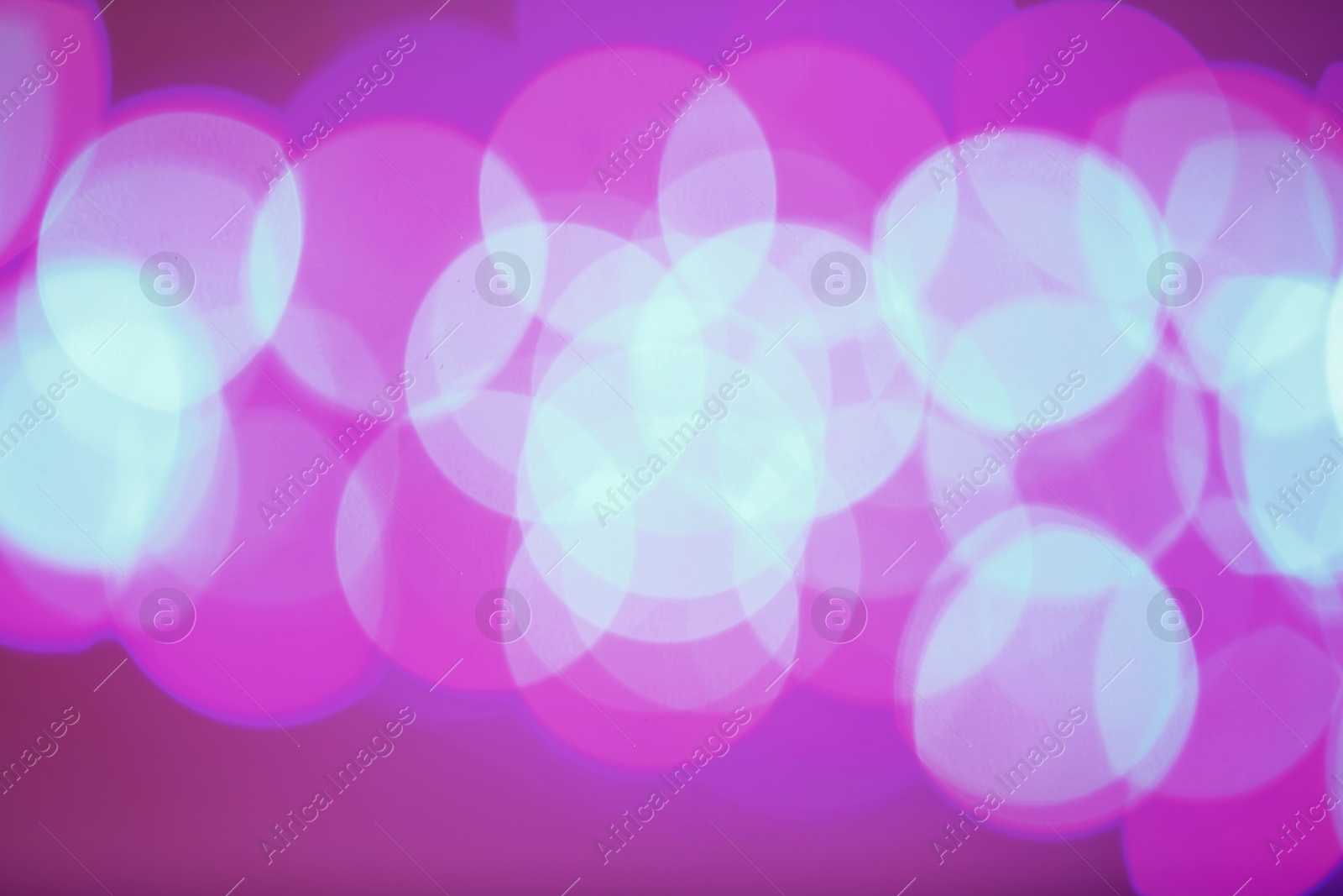 Photo of Beautiful glowing lights as background. Bokeh effect